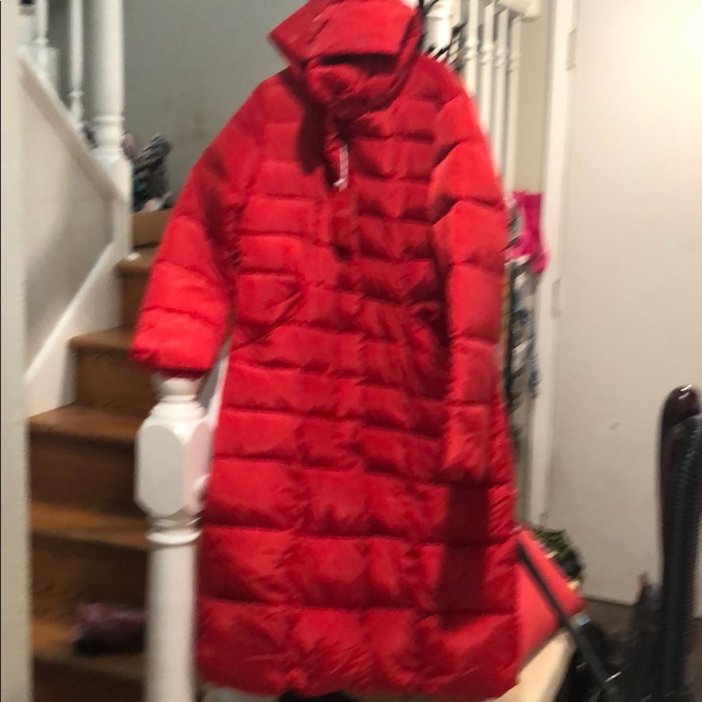 Long red coat.